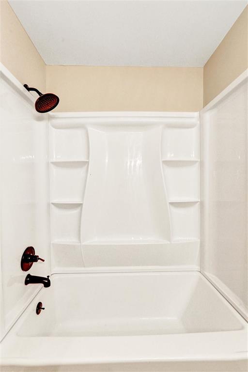 122 Capitol Avenue Winder, GA 30680 - Photo 28 of 34 a bathroom with a bathtub
