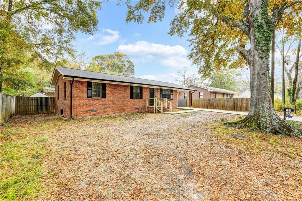 122 Capitol Avenue Winder, GA 30680 - Photo 3 of 34 front view of a house with a yard