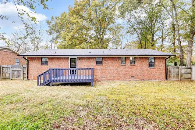a house view with swimming pool in front of it