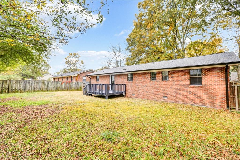 122 Capitol Avenue Winder, GA 30680 - Photo 32 of 34 a house view with swimming pool in front of it