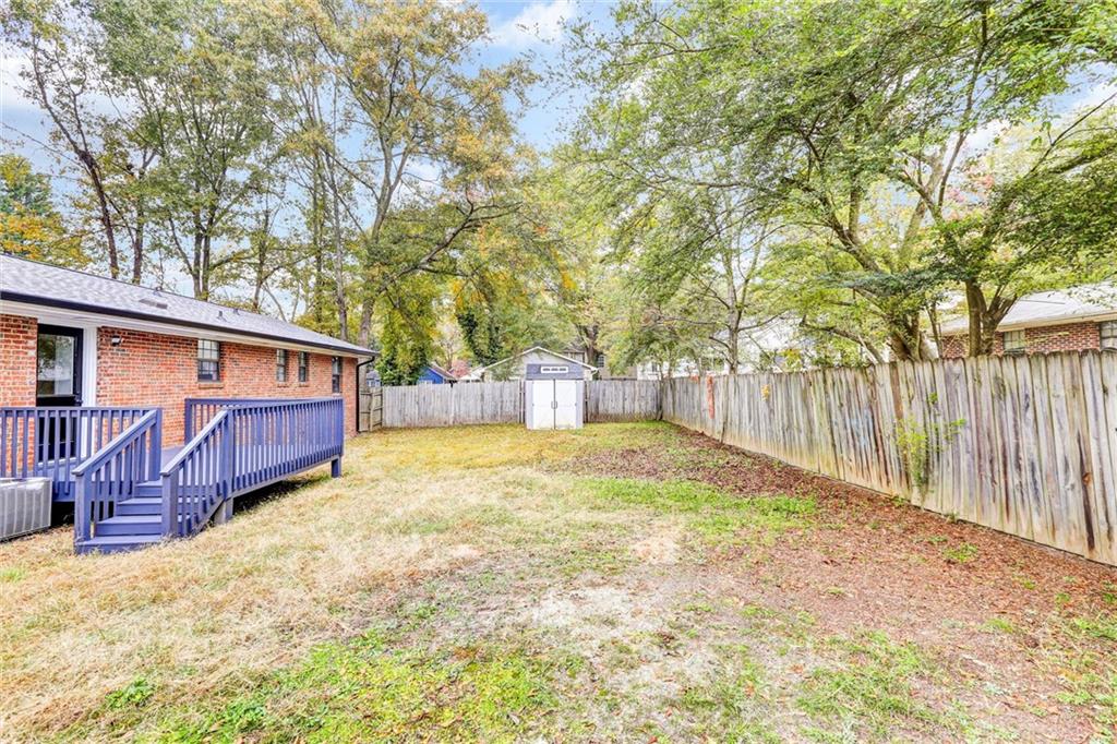 122 Capitol Avenue Winder, GA 30680 - Photo 33 of 34 a view of a house with a yard and wooden fence