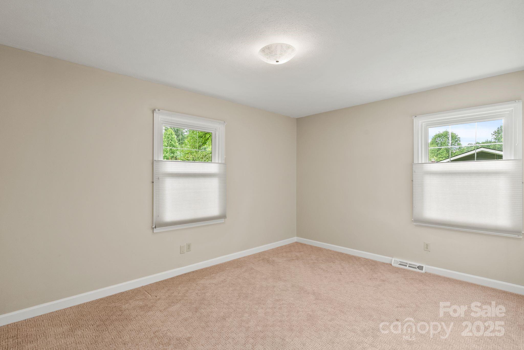 6693 Brevard Road Etowah, NC 28729 - Photo 28 of 42 an empty room with windows