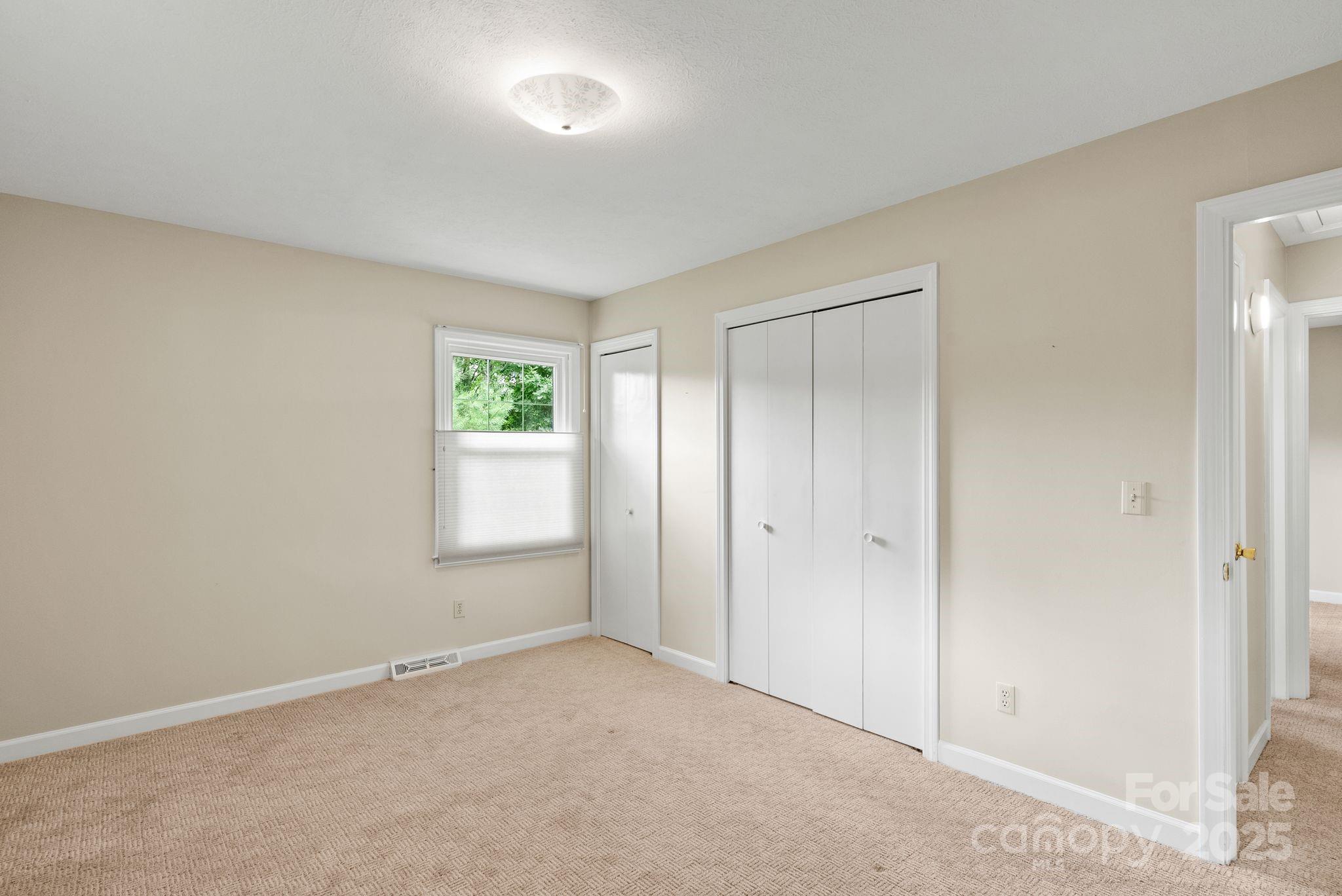 6693 Brevard Road Etowah, NC 28729 - Photo 29 of 42 a view of an empty room with a window