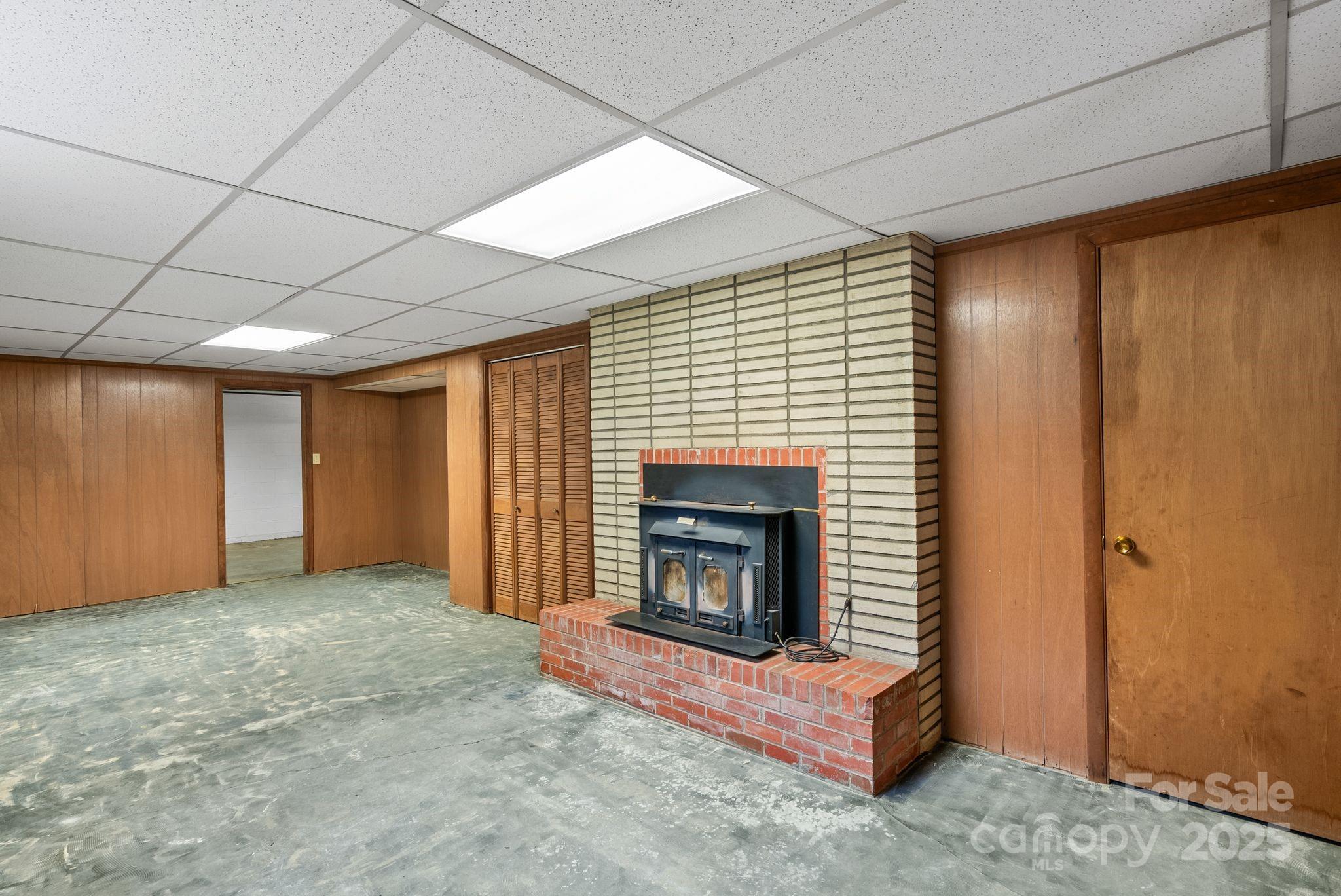 6693 Brevard Road Etowah, NC 28729 - Photo 34 of 42 a view of an empty room with a fireplace