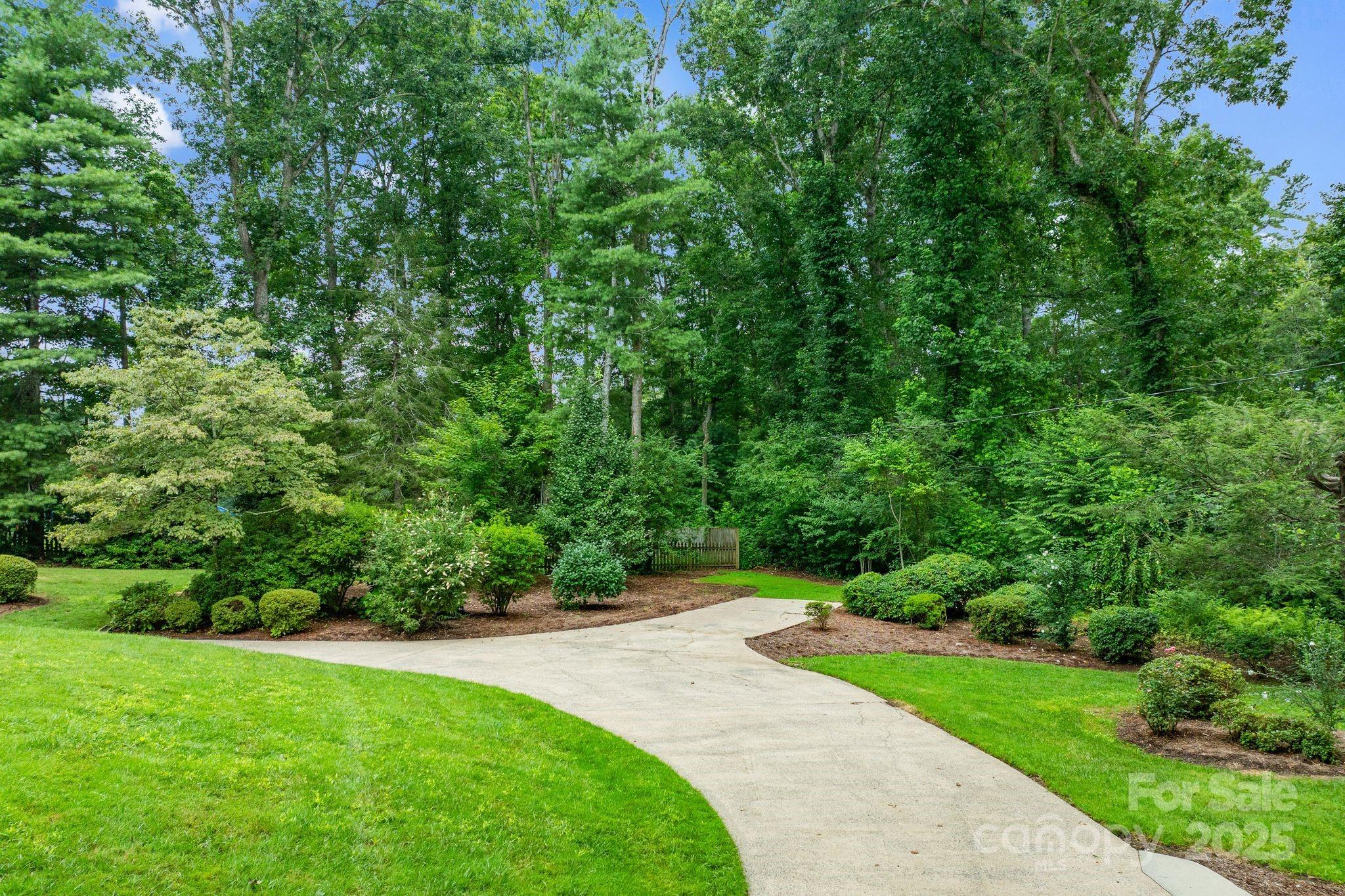 6693 Brevard Road Etowah, NC 28729 - Photo 5 of 42 a view of a backyard with green space