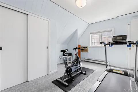 a view of a chairs and table on the roof deck