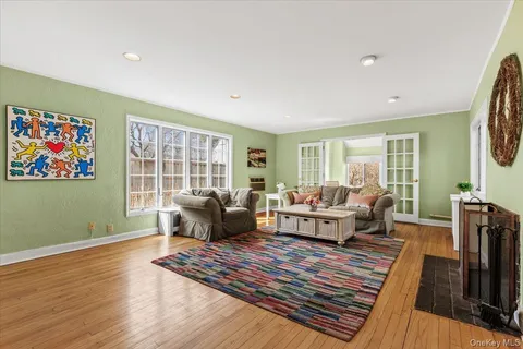 a living room with furniture rug and window