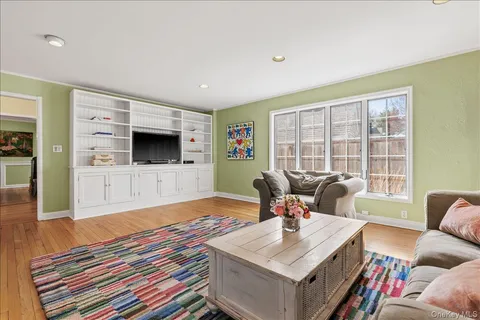 a living room with a flat screen tv and a couch
