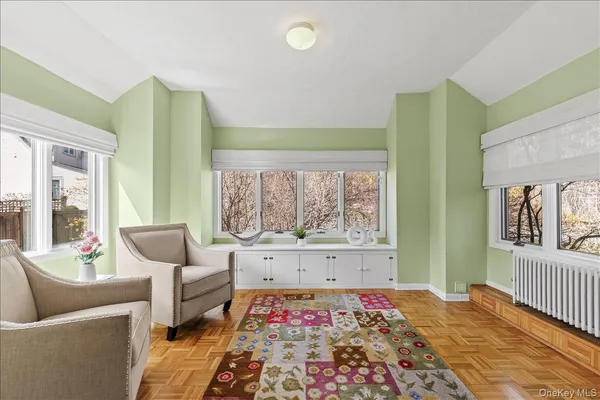 a bedroom with furniture and a window