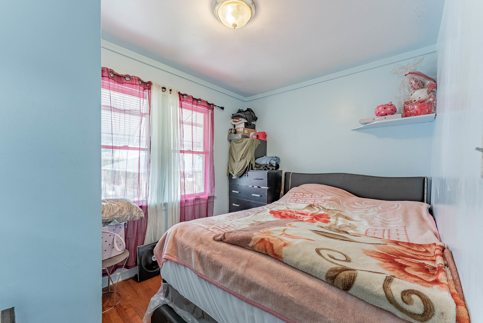 2541 North Mont Clare Avenue Chicago, IL 60707 - Photo 15 of 31 a bedroom with a bed and a painting on the wall