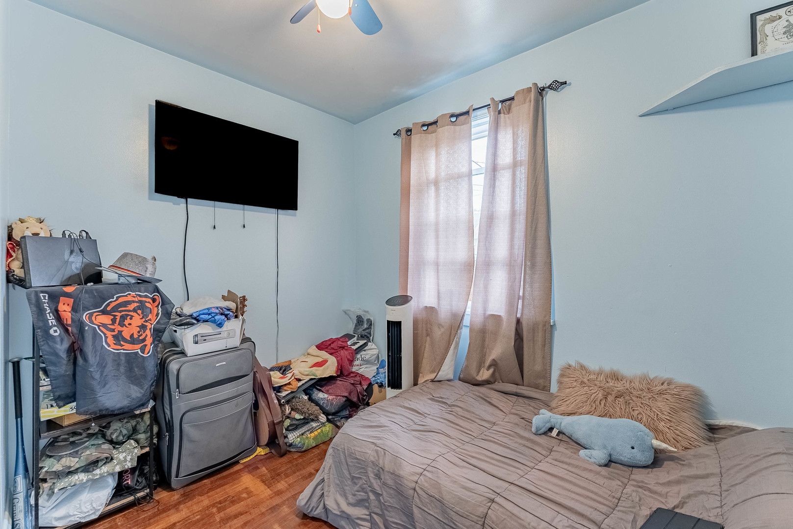 2541 North Mont Clare Avenue Chicago, IL 60707 - Photo 16 of 31 a bedroom with a bed and wooden floor