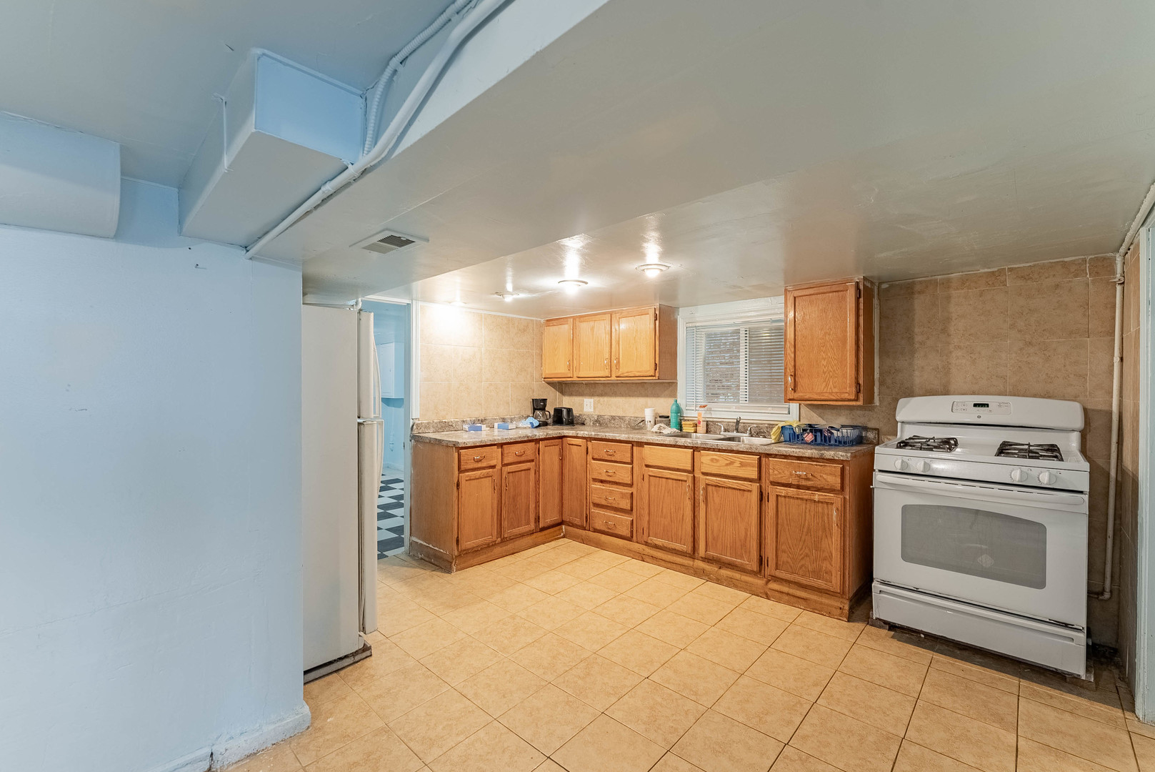 2541 North Mont Clare Avenue Chicago, IL 60707 - Photo 19 of 31 a kitchen with stainless steel appliances granite countertop a stove a sink and a refrigerator