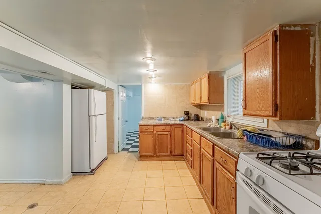 a kitchen with stainless steel appliances granite countertop a sink and cabinets