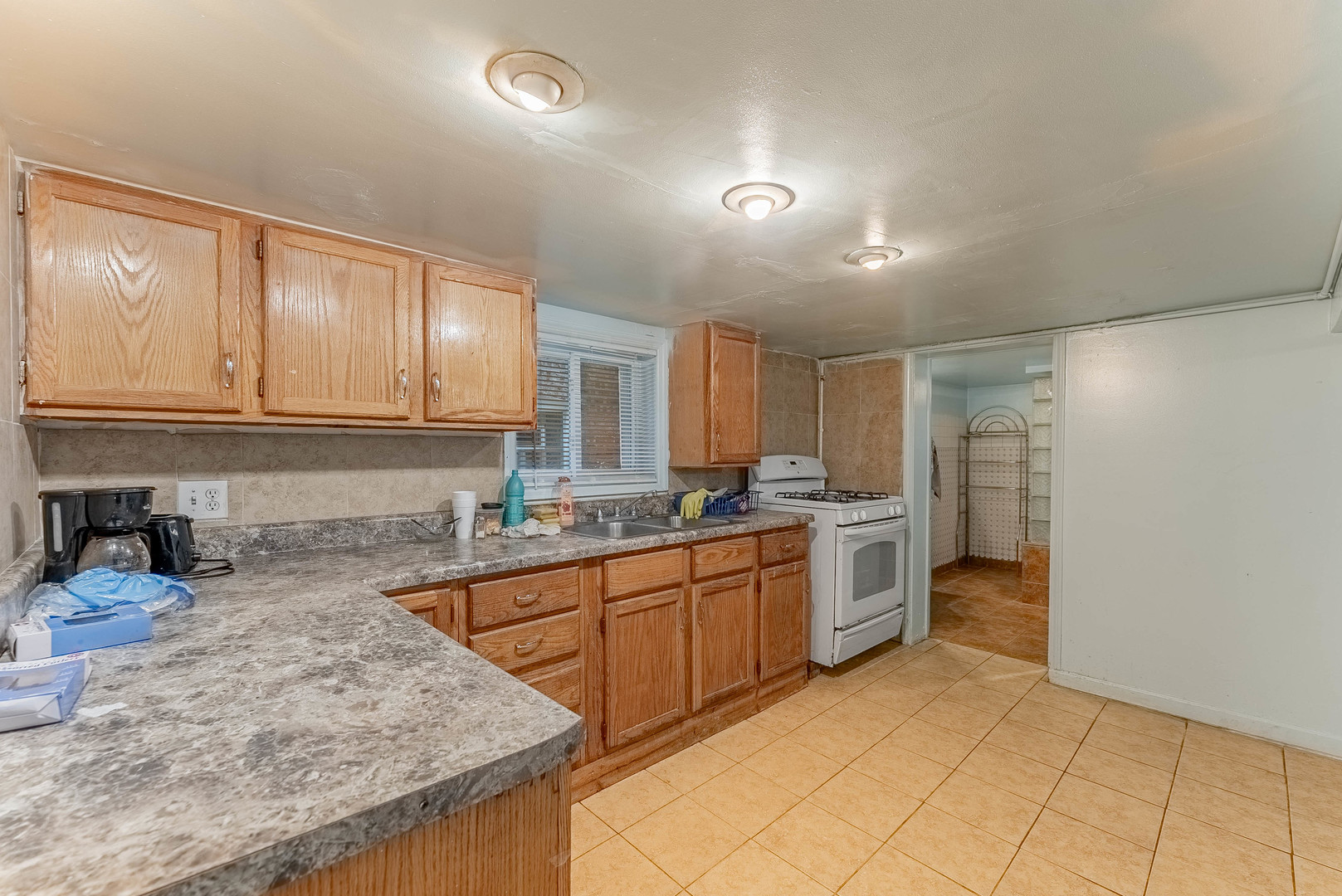 2541 North Mont Clare Avenue Chicago, IL 60707 - Photo 21 of 31 a kitchen with stainless steel appliances granite countertop a sink and cabinets