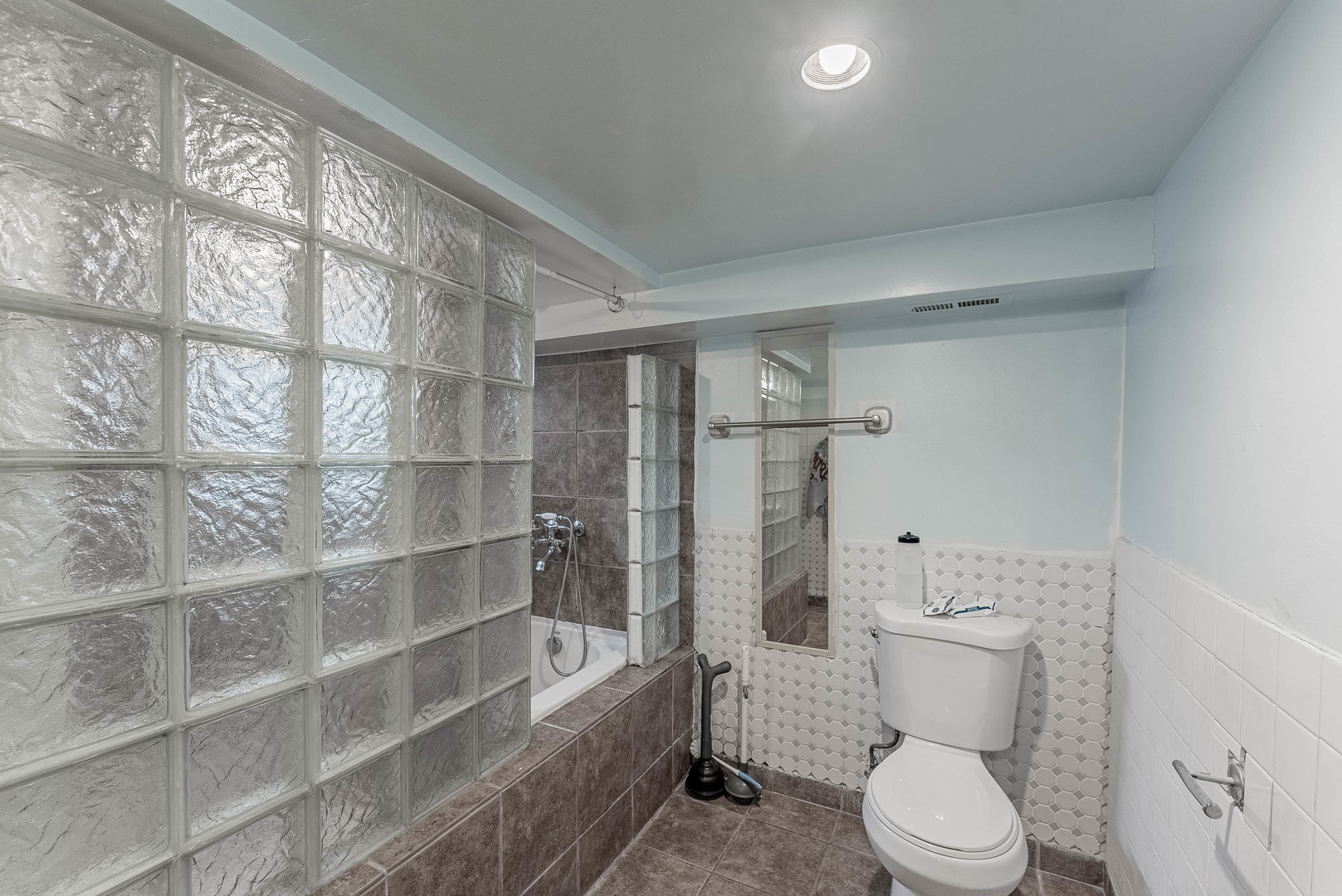 2541 North Mont Clare Avenue Chicago, IL 60707 - Photo 22 of 31 a white toilet sitting next to a bathroom sink