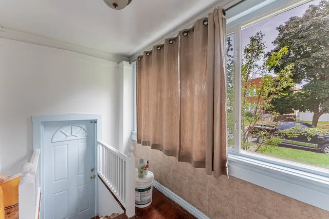 a bathroom with a toilet and a shower curtain
