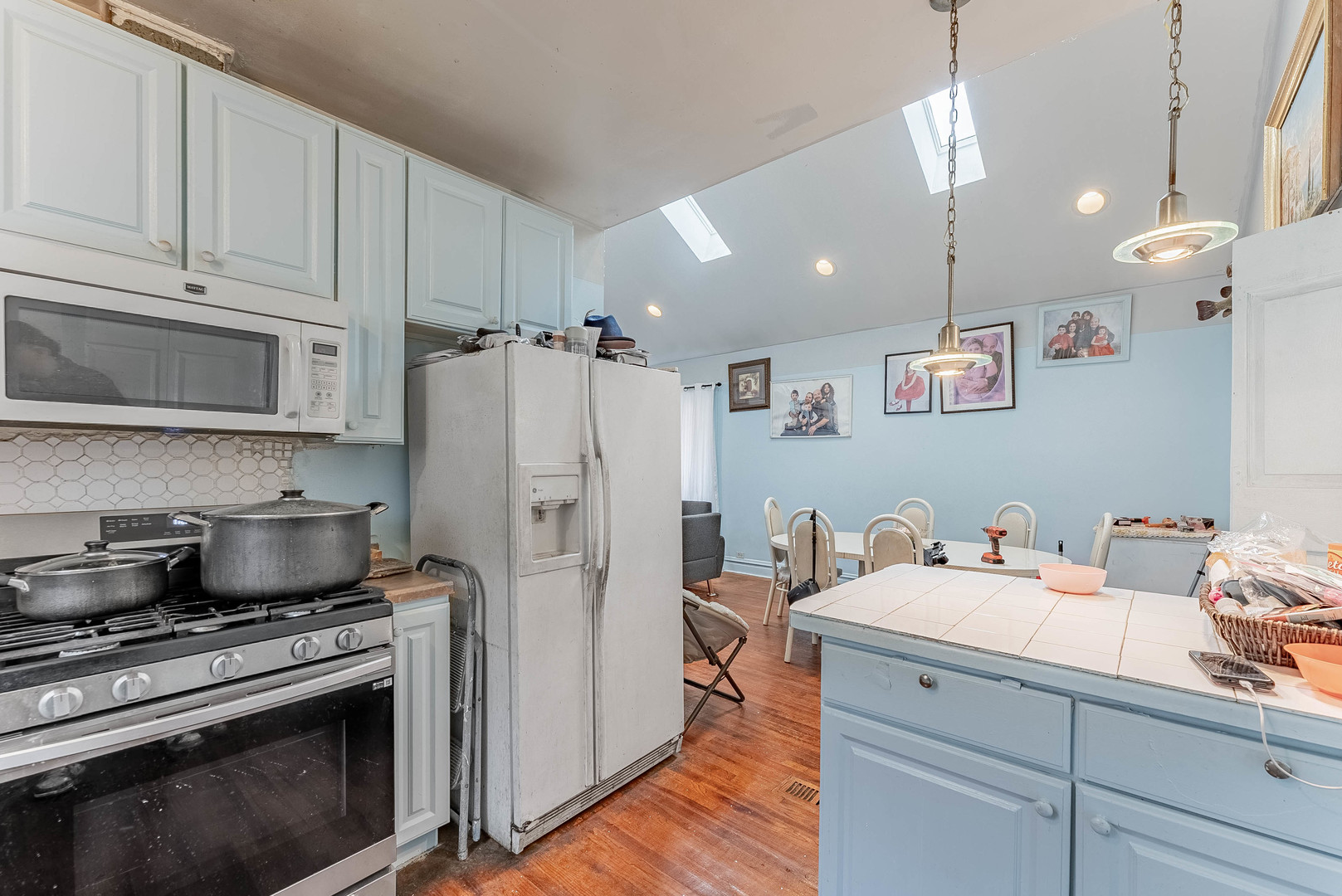 2541 North Mont Clare Avenue Chicago, IL 60707 - Photo 6 of 31 a kitchen with a sink a stove and refrigerator