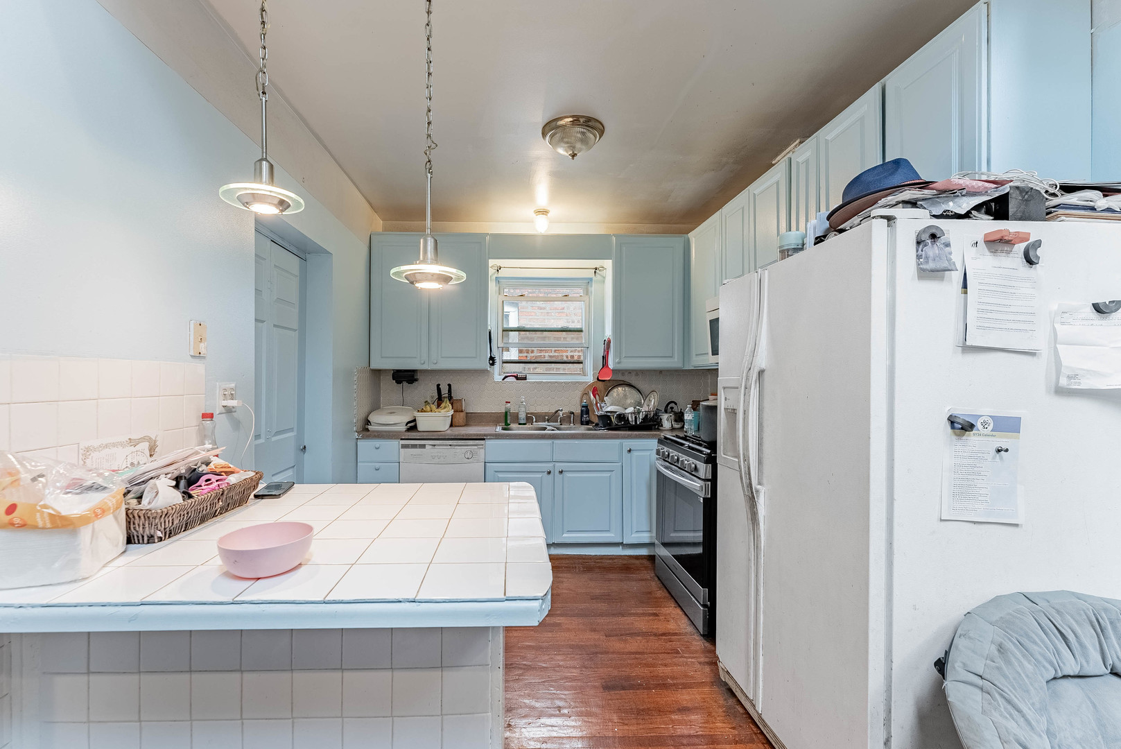 2541 North Mont Clare Avenue Chicago, IL 60707 - Photo 8 of 31 a kitchen with granite countertop a refrigerator and a sink