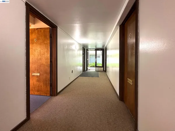 a view of hallway with windows