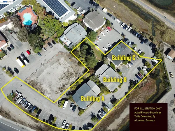 an aerial view of a residential apartment building with a lot of plants