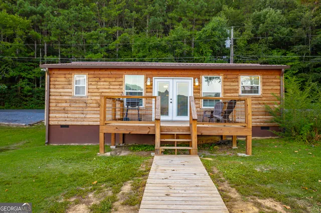 a lake view with sitting space and outdoor seating