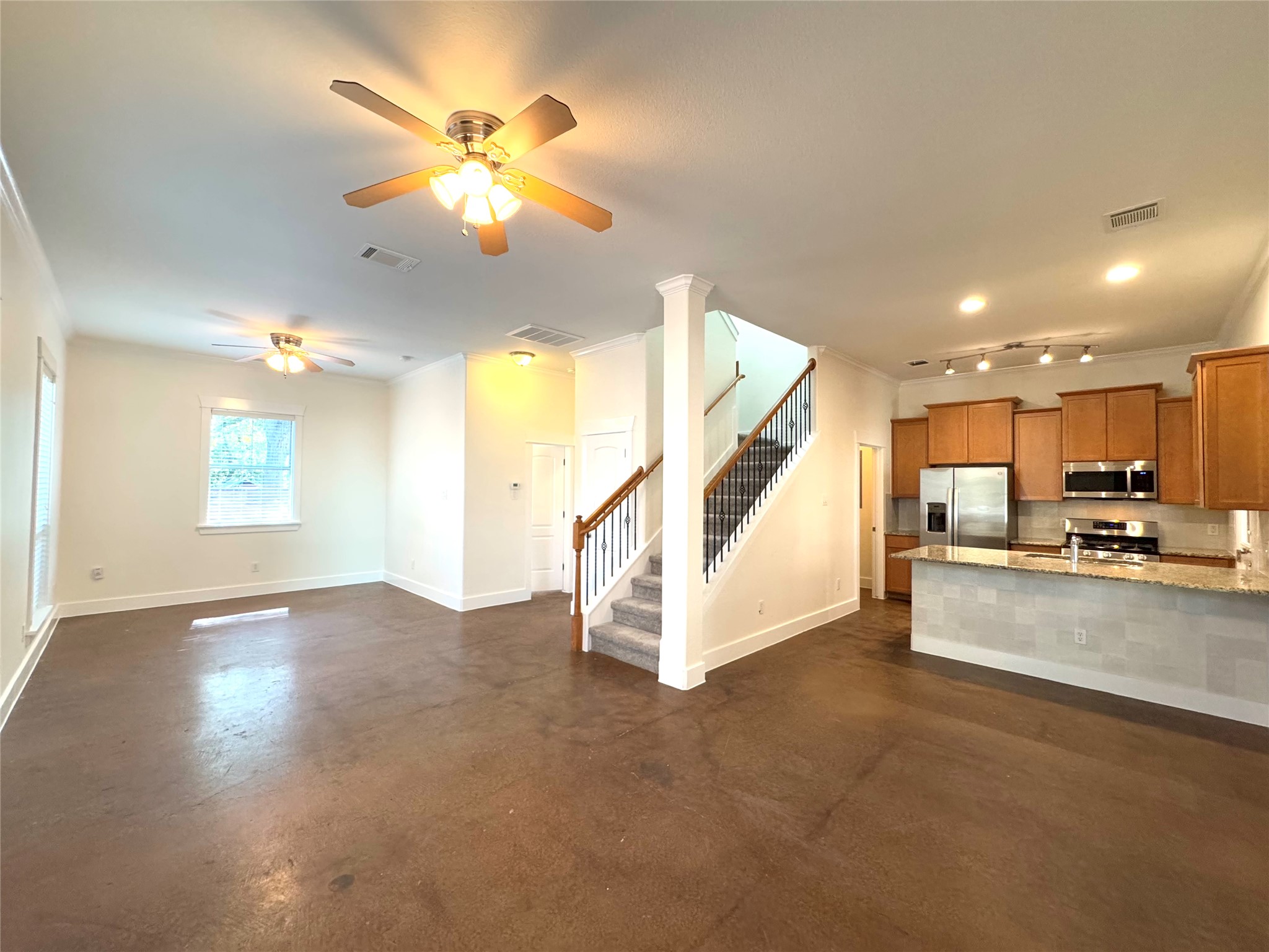 609 Franklin Boulevard, Unit A Austin, TX 78751 - Photo 1 of 1 a view of a livingroom with furniture a ceiling fan and window