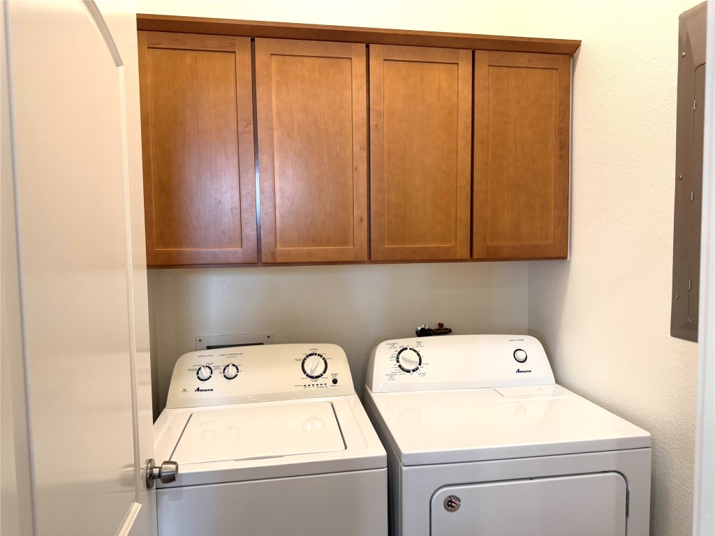 609 Franklin Boulevard, Unit A Austin, TX 78751 - Photo 5 of 19 Washroom with washing machine and clothes dryer, and built in cabinets