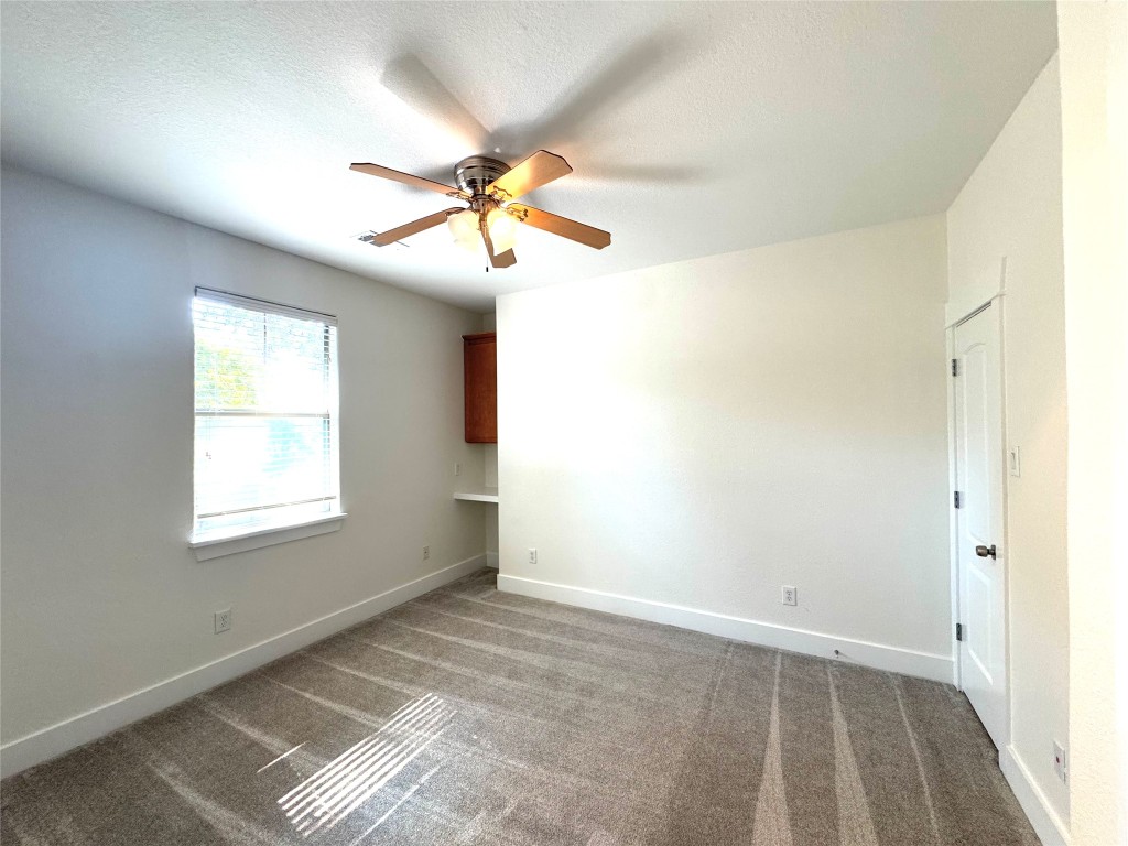 609 Franklin Boulevard, Unit A Austin, TX 78751 - Photo 6 of 19 2nd Upstairs bedroom with ceiling fan