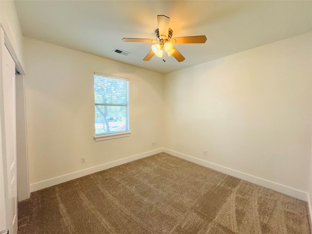 609 Franklin Boulevard, Unit A Austin, TX 78751 - Photo 8 of 19 3rd bedroom upstairs with ceiling fan.