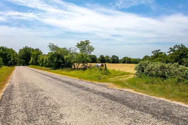 a view of a swimming pool and a yard