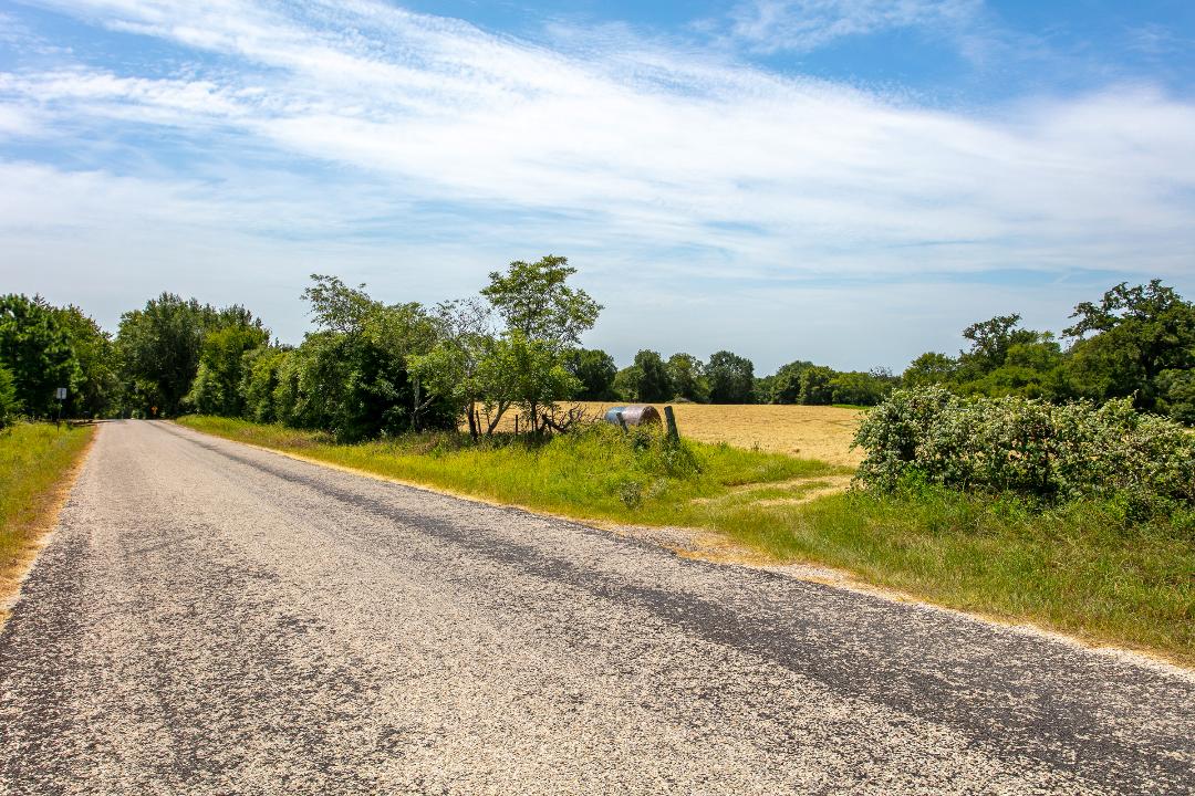 1755 Pleasant Hill Road Bryan, TX 77807 - Photo 2 of 28 a view of a swimming pool and a yard