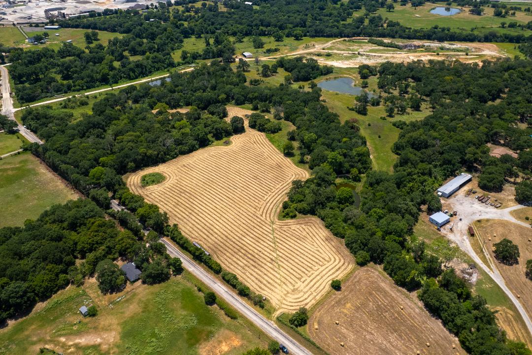 1755 Pleasant Hill Road Bryan, TX 77807 - Photo 7 of 28 a view of a yard with plants and pool
