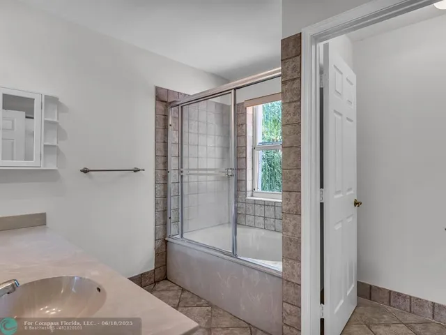 a bathroom with a sink and a bathtub