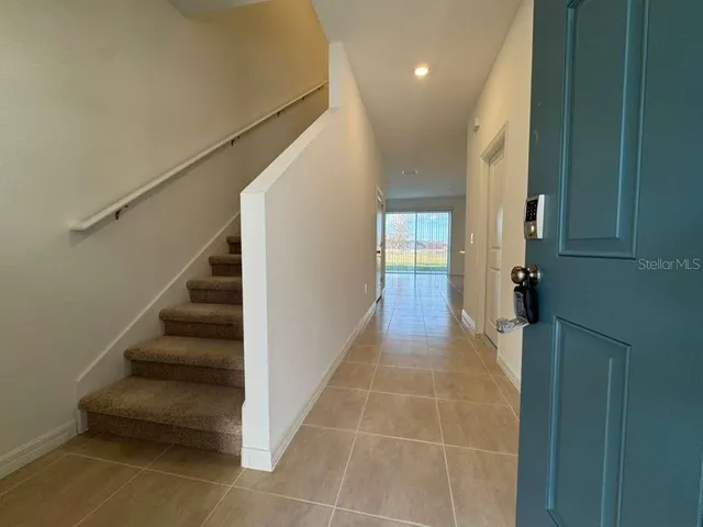 a view of entryway and hall with a window