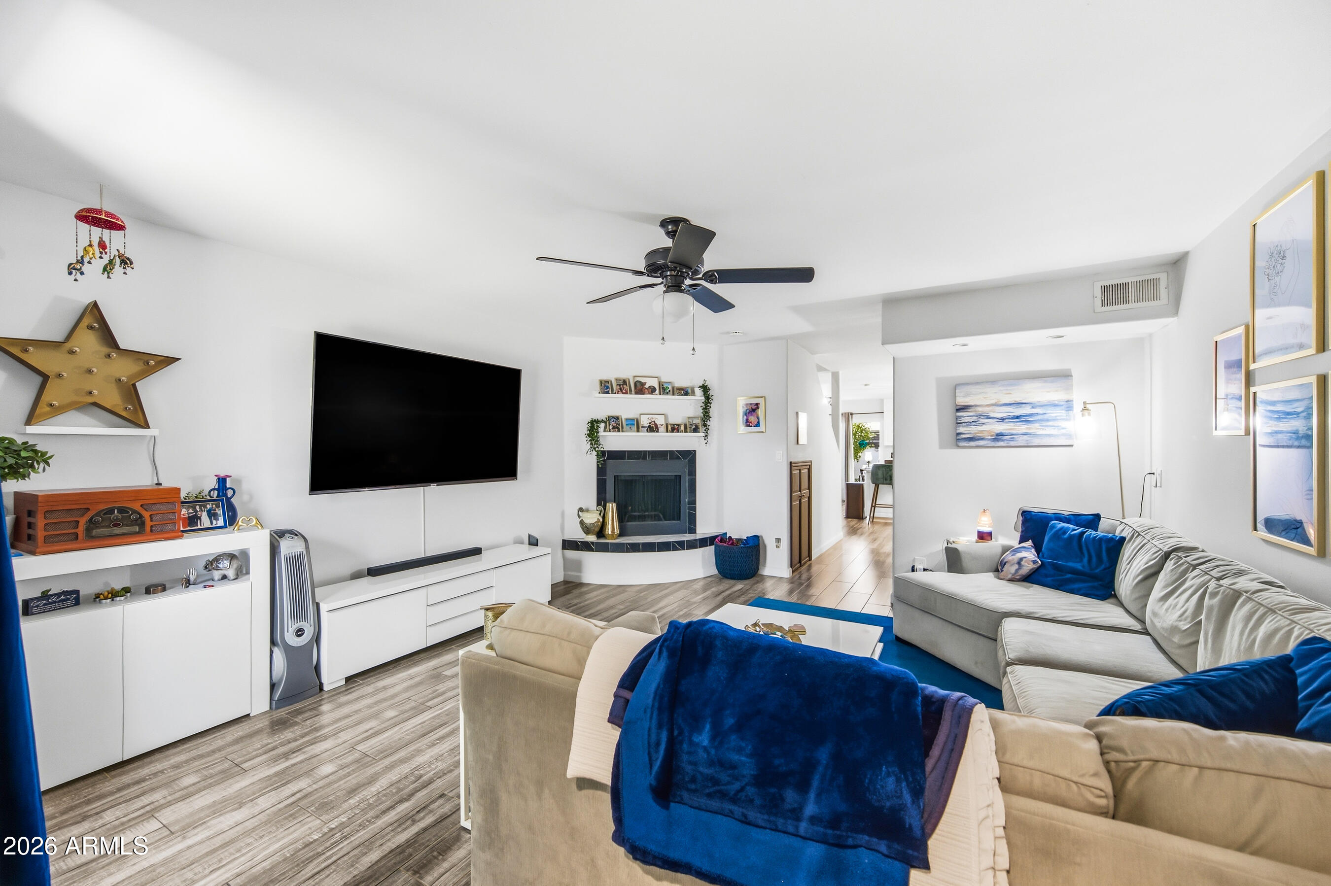 1702 East Ocotillo Road, Unit 1 Phoenix, AZ 85016 - Photo 3 of 27 a living room with furniture and a flat screen tv