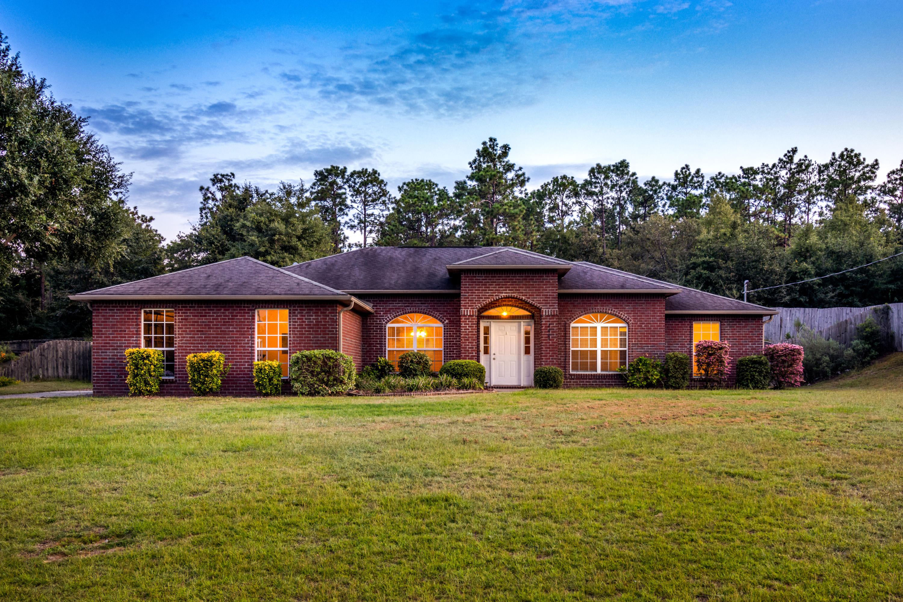 2609 Corner Creek Road Crestview, FL 32536 - Photo 1 of 22 a front view of a house with a yard