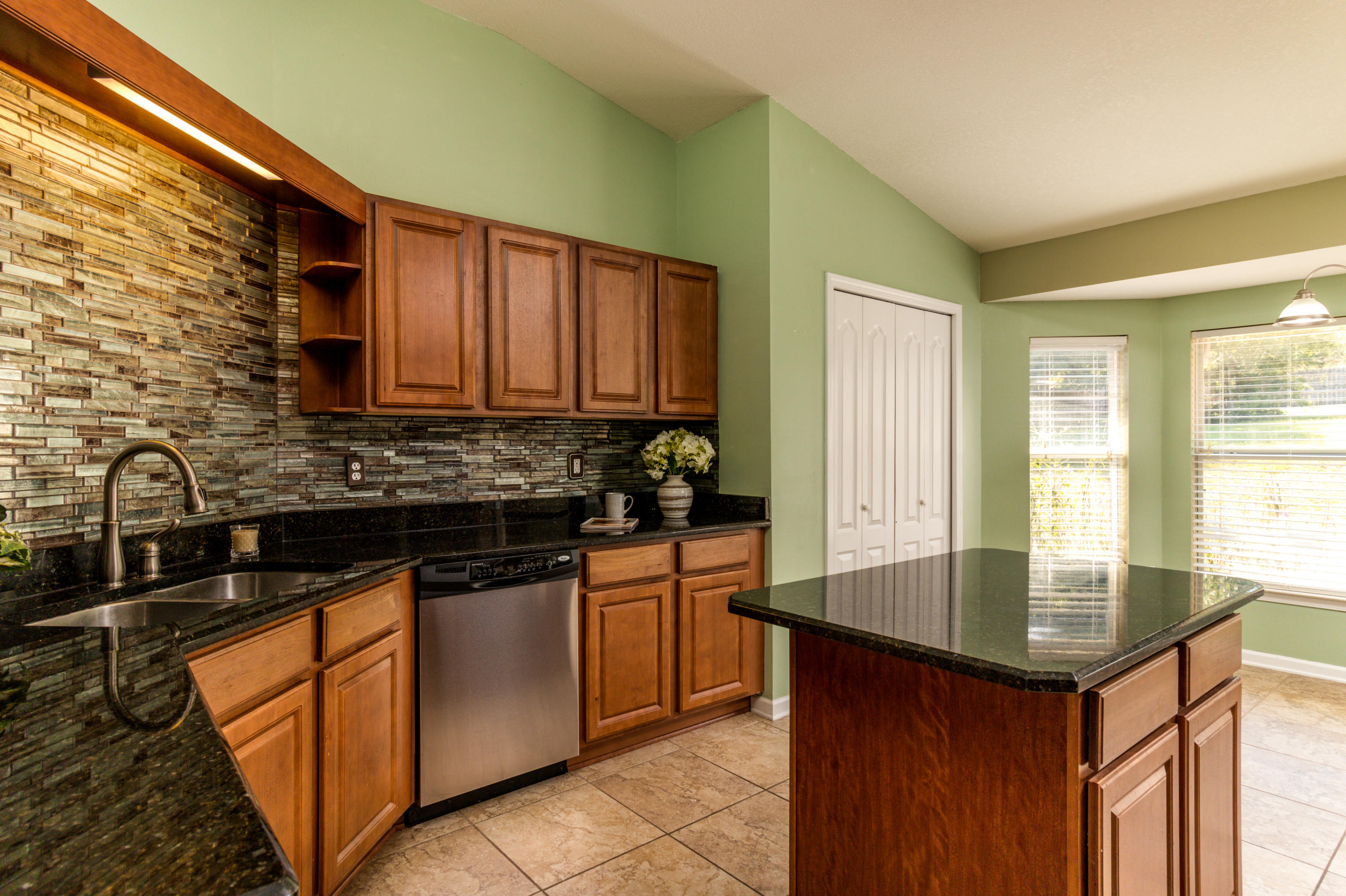 2609 Corner Creek Road Crestview, FL 32536 - Photo 6 of 22 a kitchen with stainless steel appliances granite countertop a sink stove and cabinets