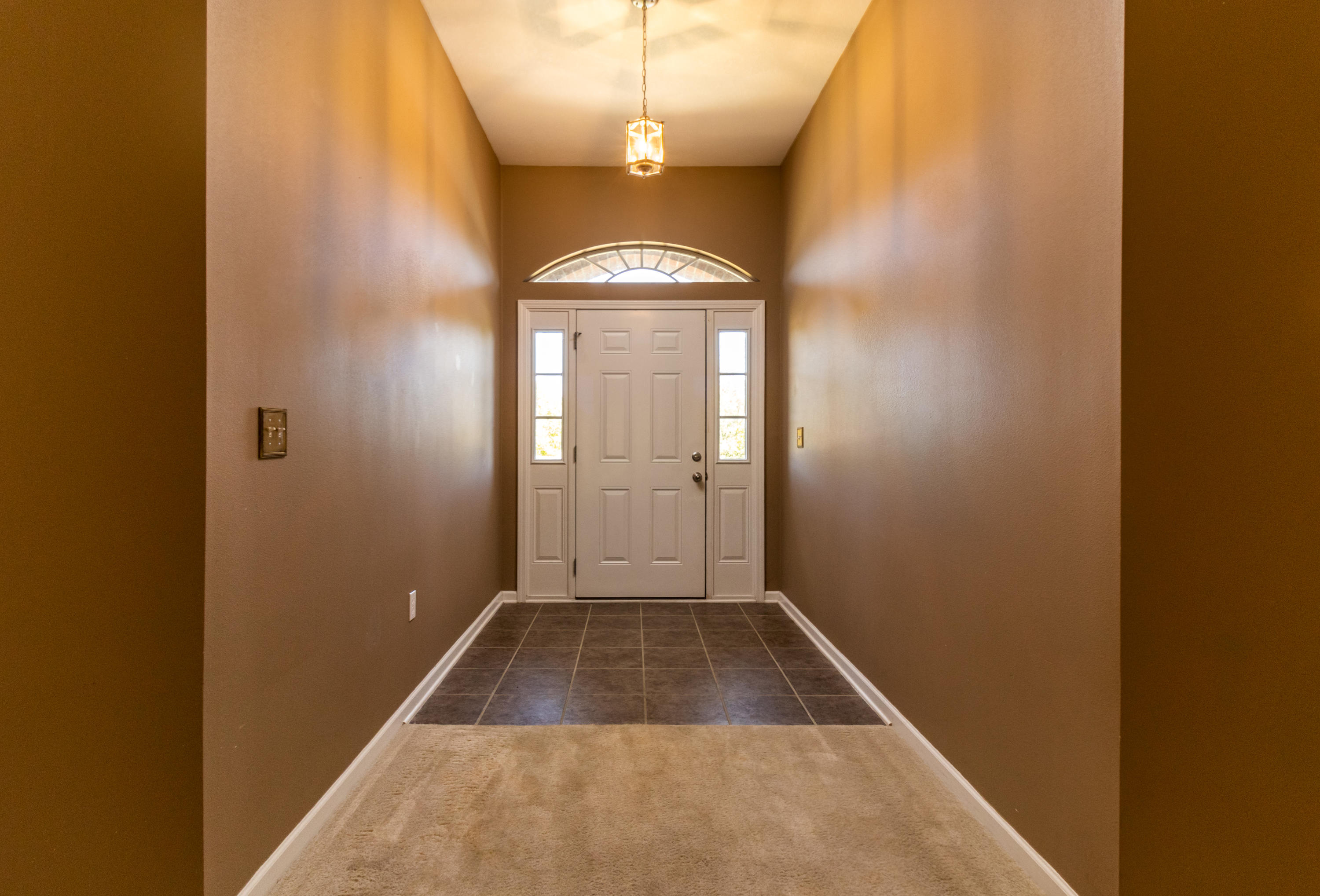 2609 Corner Creek Road Crestview, FL 32536 - Photo 8 of 22 a view of a hallway with wooden floor and a window