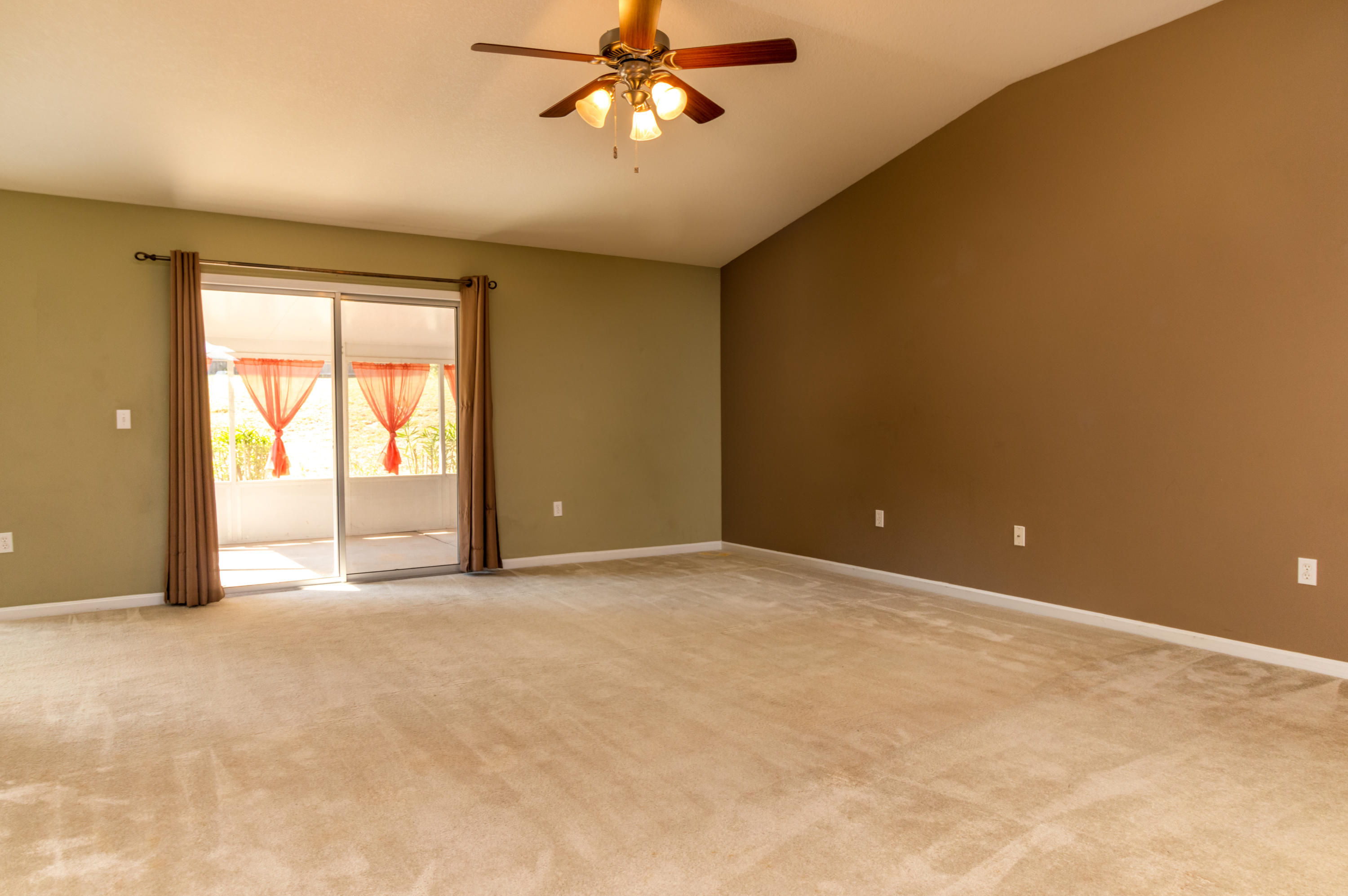 2609 Corner Creek Road Crestview, FL 32536 - Photo 9 of 22 an empty room with windows and fan