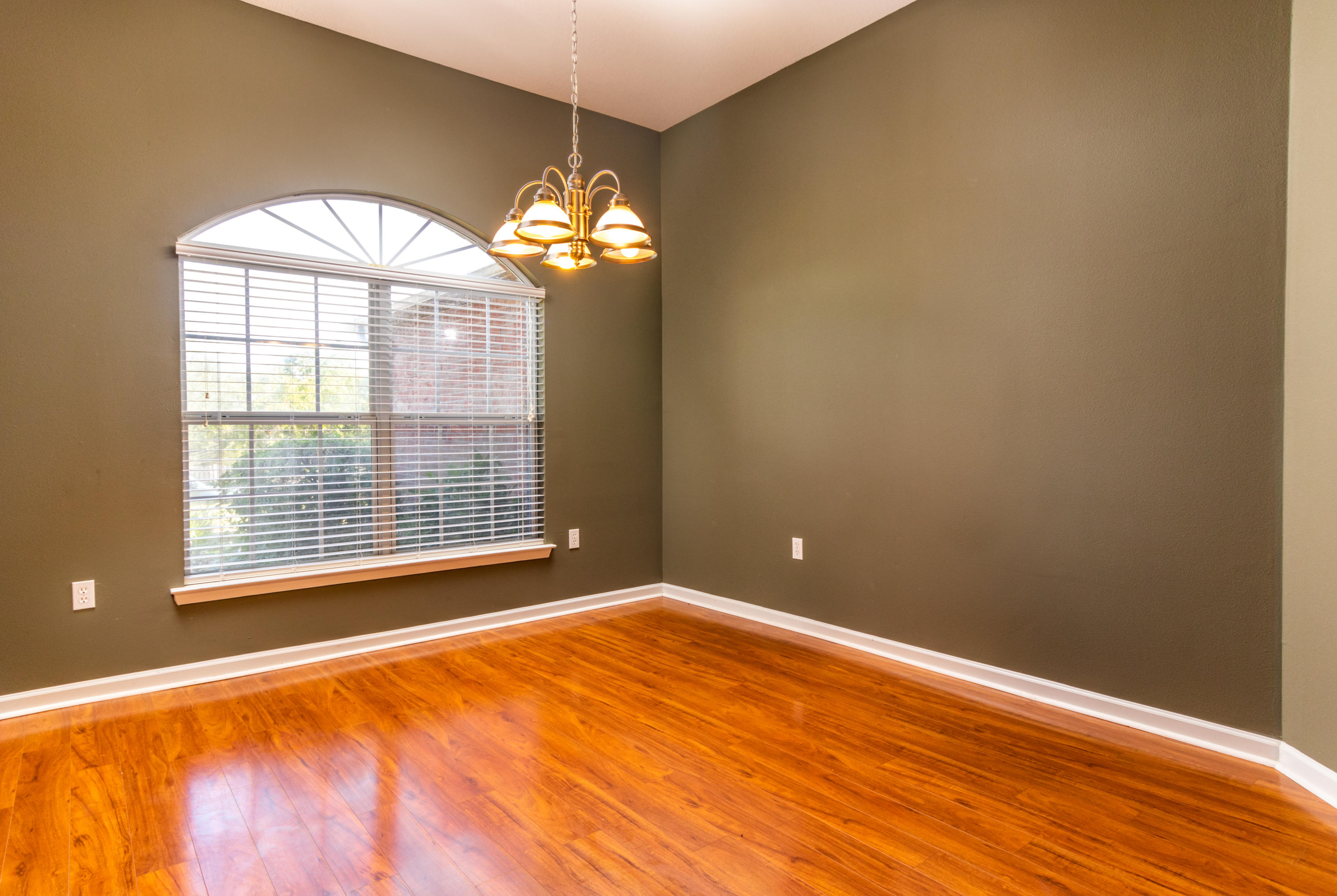2609 Corner Creek Road Crestview, FL 32536 - Photo 10 of 22 a view of empty room with wooden floor and fan
