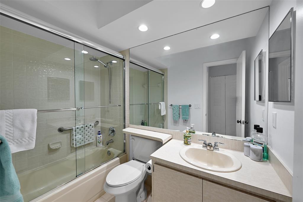 10788 Waterberry Drive Boca Raton, FL 33498 - Photo 19 of 30 a bathroom with a sink toilet and shower