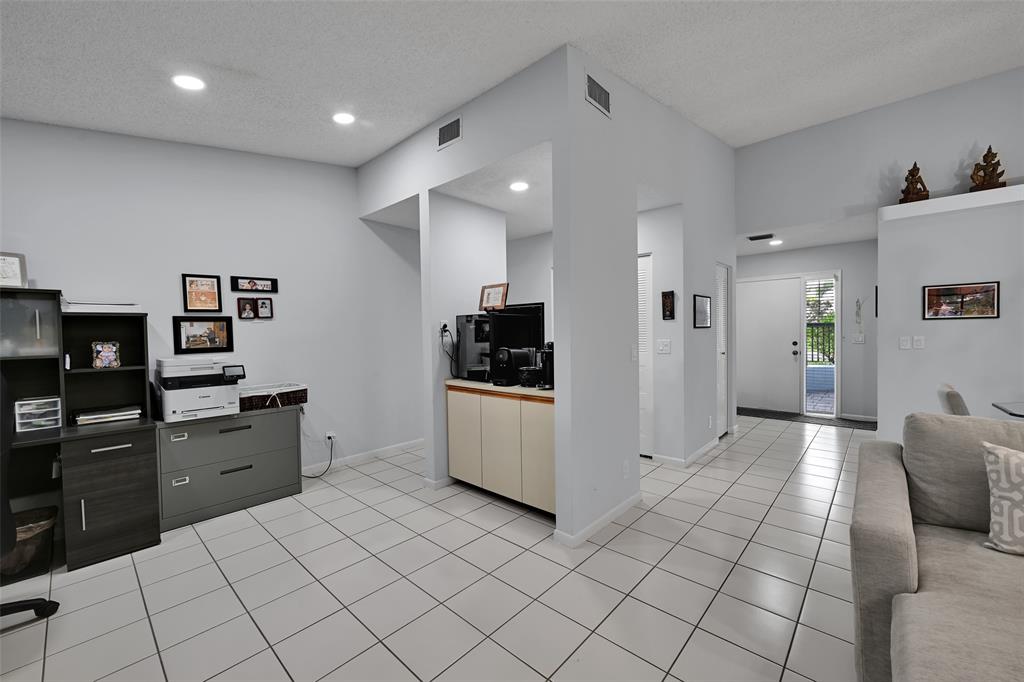 10788 Waterberry Drive Boca Raton, FL 33498 - Photo 22 of 30 a kitchen with a sink and cabinets