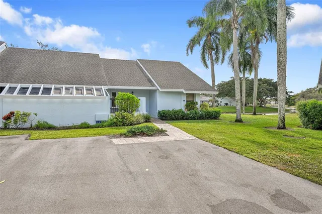a view of a house with a yard