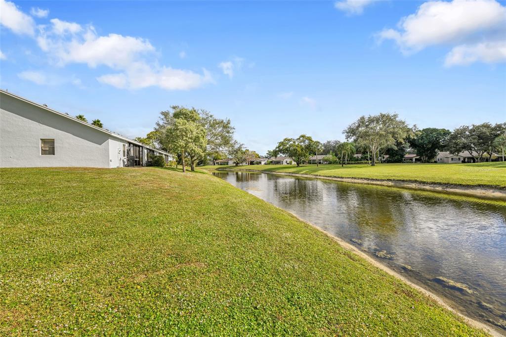 10788 Waterberry Drive Boca Raton, FL 33498 - Photo 30 of 30 a view of a lake with houses in the background