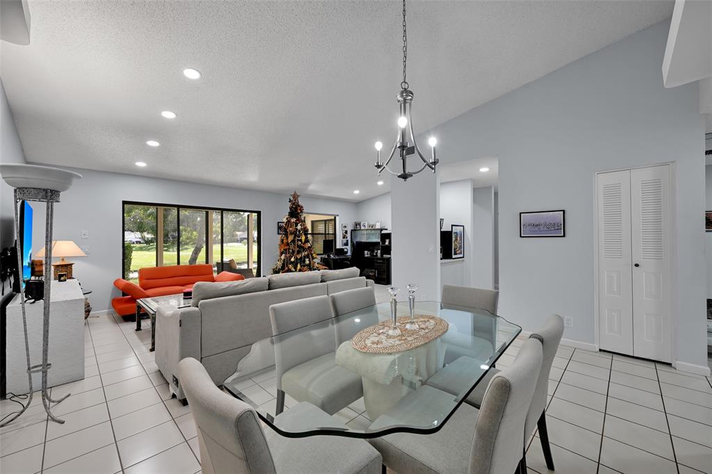 10788 Waterberry Drive Boca Raton, FL 33498 - Photo 6 of 30 a living room with furniture and a large window