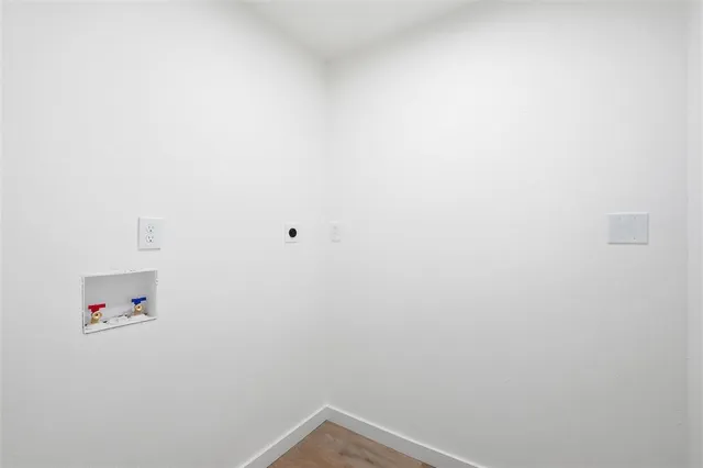 a view of storage and utility room with baby crib