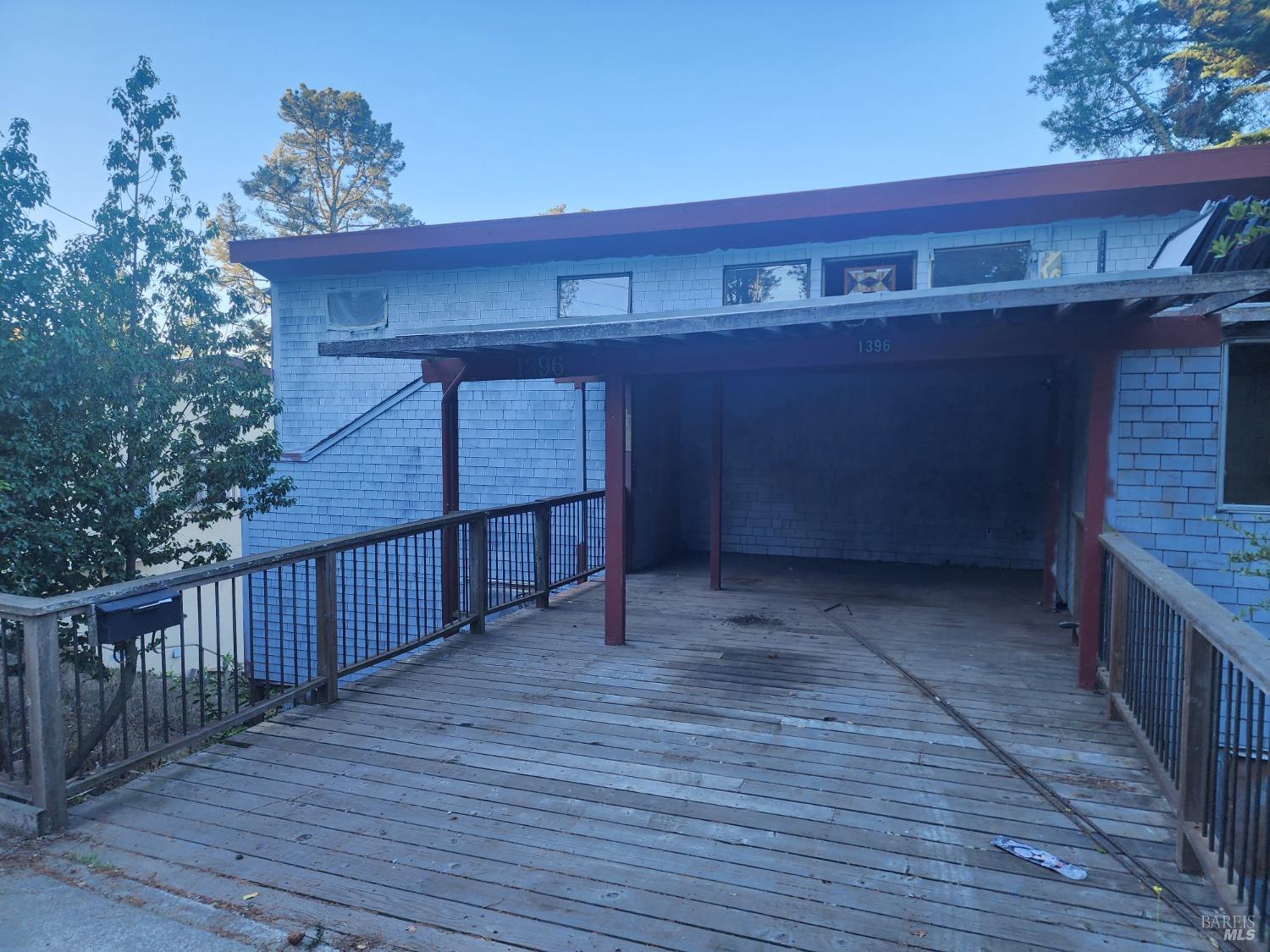 1396 Summit Road Berkeley, CA 94708 - Photo 1 of 1 a view of a wooden house with a large window