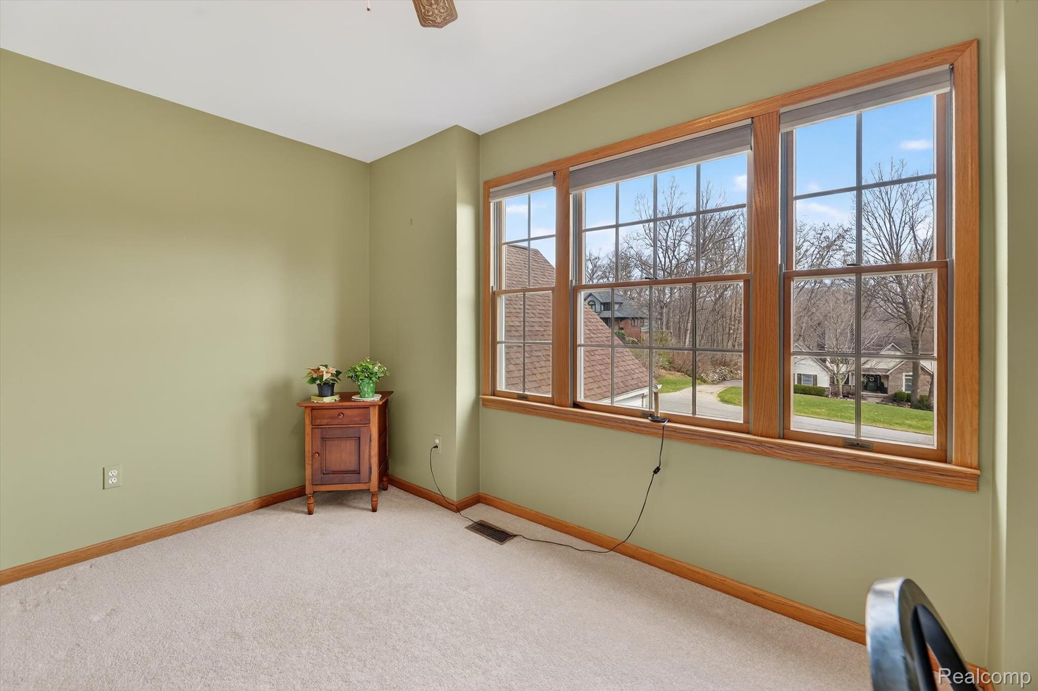 7798 Lee Road Brighton, MI 48116 - Photo 21 of 49 Unfurnished room with light carpet and baseboards