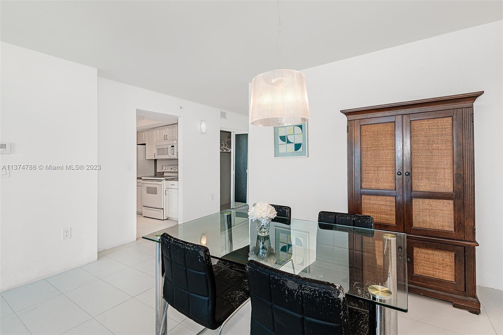90 Alton Road, Unit 905 Miami Beach, FL 33139 - Photo 15 of 33 a view of a workspace room with furniture and window