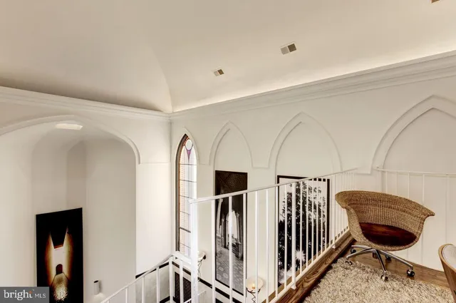 a living room with a table and chairs